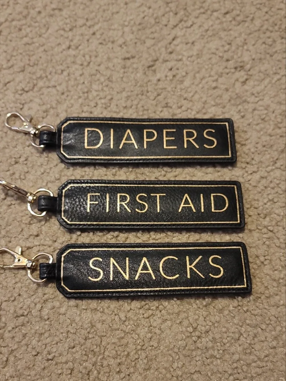 Itzy Ritzy Black and Gold 'Diapers/First Aid/Snacks' Organizer Key Tags